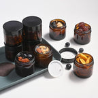 Bumobum 2 oz Glass Jars with Lids, 48 pack Round Small Containers with Black Lids, Blank Labels & Inner Liners, Empty Cosmetic Containers for Sample, Powder, Cream, Lotion Amber and Blue