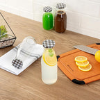 Restaurantware French Countryside 15 Ounce Glass Bottles 10 Durable Juice Bottles - With Black Plaid Lid Dishwashable Clear Glass Countryside Bottles For Hot And Cold Beverages